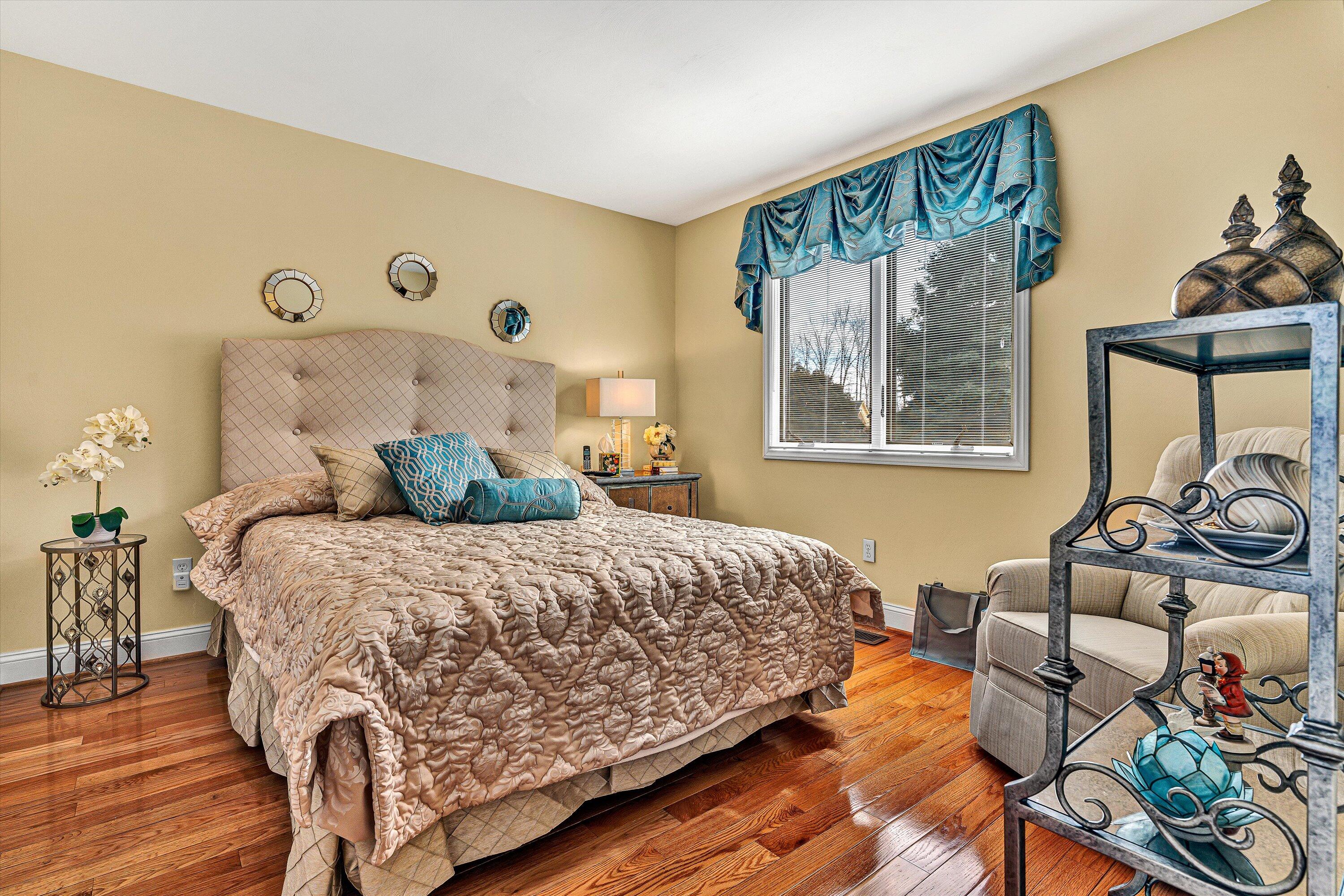 540 Cedar Ridge Road Union Hall, VA 24176 - Photo 19 of 46 a bedroom with a bed and a window