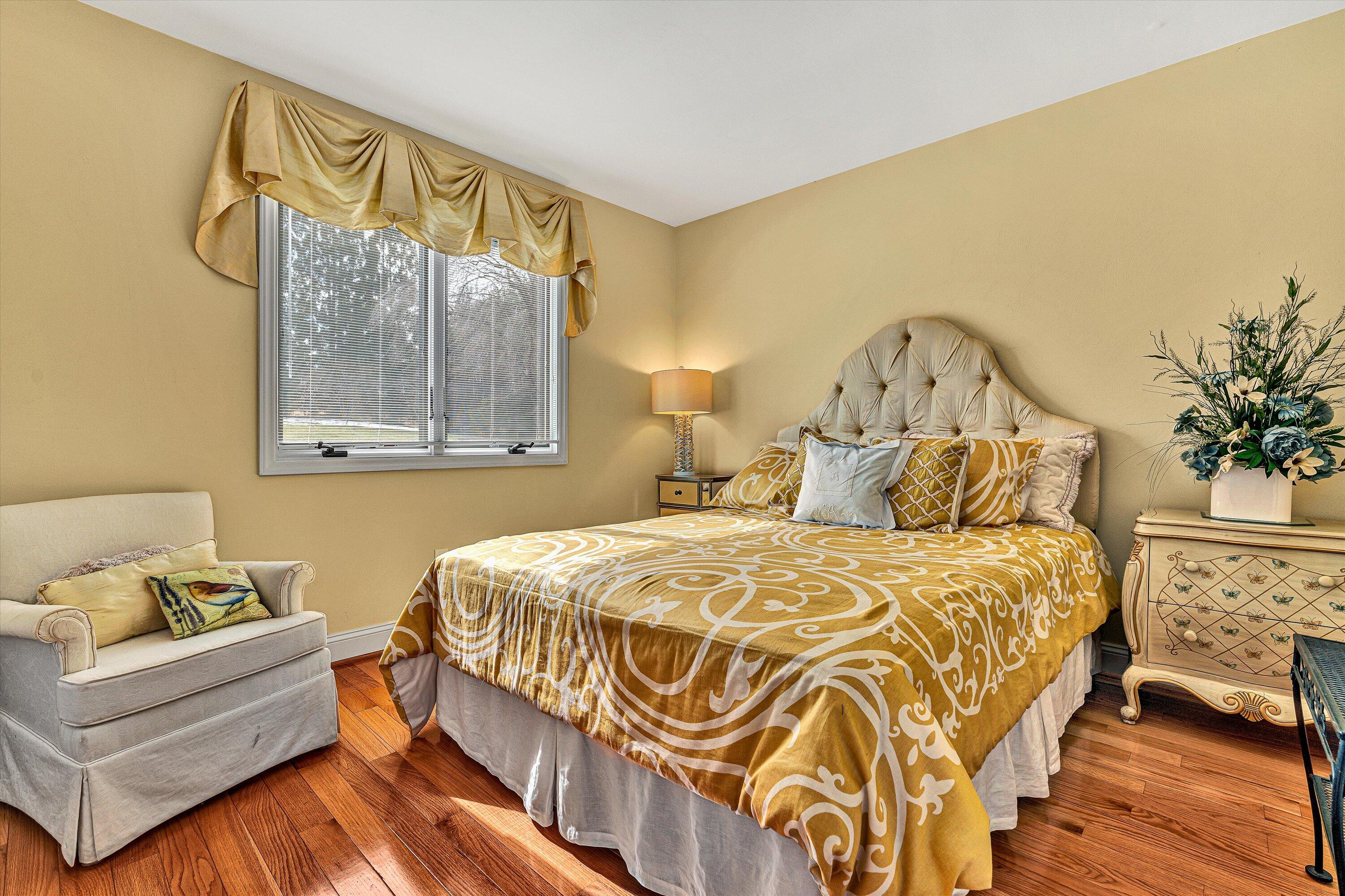 540 Cedar Ridge Road Union Hall, VA 24176 - Photo 20 of 46 a bedroom with a bed and wooden floor