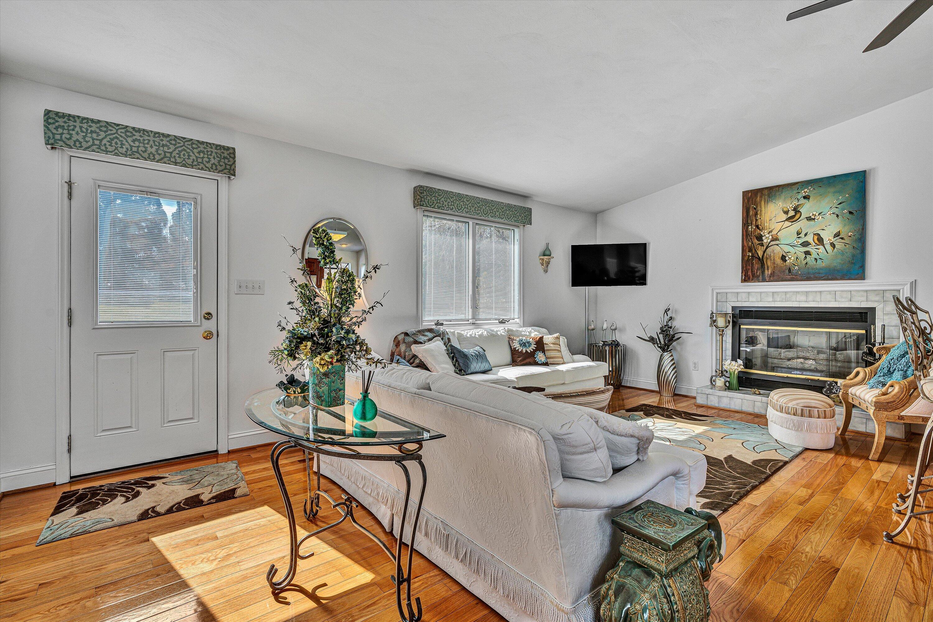 540 Cedar Ridge Road Union Hall, VA 24176 - Photo 5 of 46 a living room with furniture a flat screen tv and a fireplace