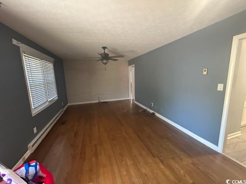 1105 Scott Drive Myrtle Beach, SC 29577 - Photo 2 of 7 Unfurnished living room featuring a textured ceili
