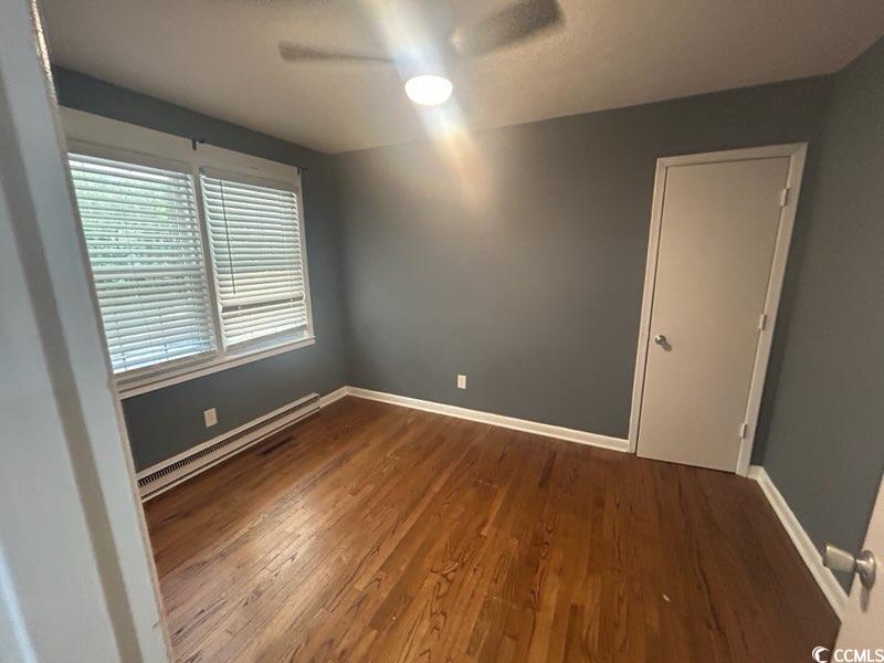 1105 Scott Drive Myrtle Beach, SC 29577 - Photo 5 of 7 Unfurnished room featuring baseboards, wood finish