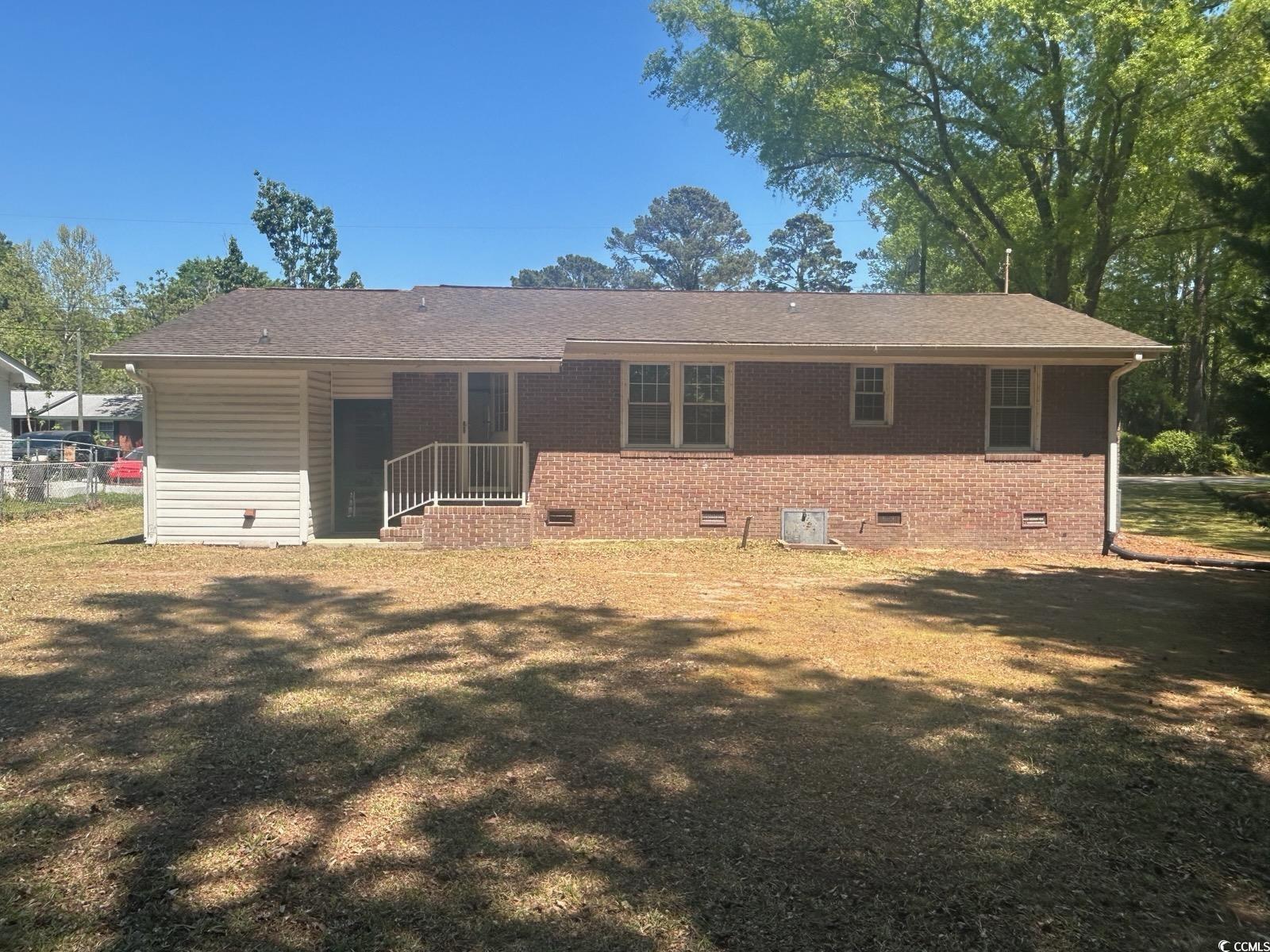 1105 Scott Drive Myrtle Beach, SC 29577 - Photo 7 of 7 Back of property with a lawn, crawl space, roof wi