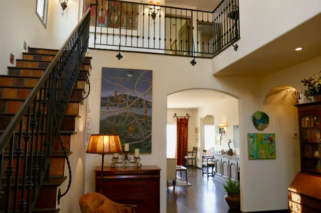a view of living room with furniture and entryway