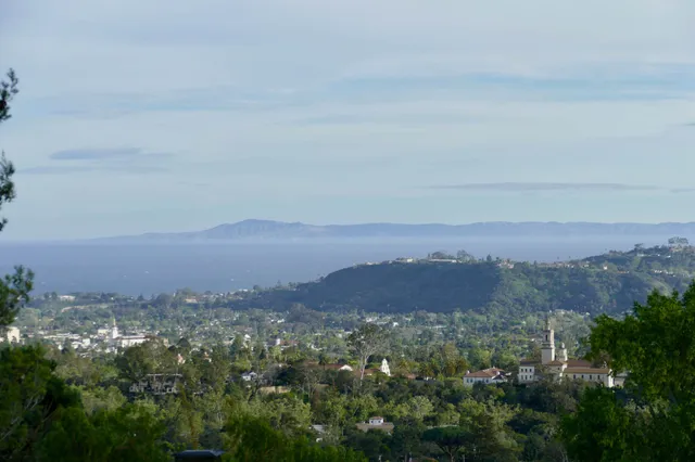 an aerial view of residential house and green space