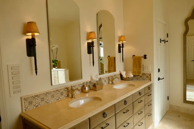 a bathroom with a sink double vanity and a mirror