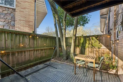 a view of balcony with furniture