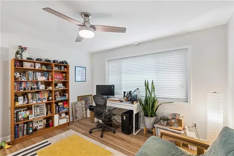 a work room with furniture and book shelf