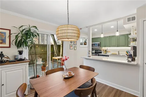 a kitchen with a table and chairs