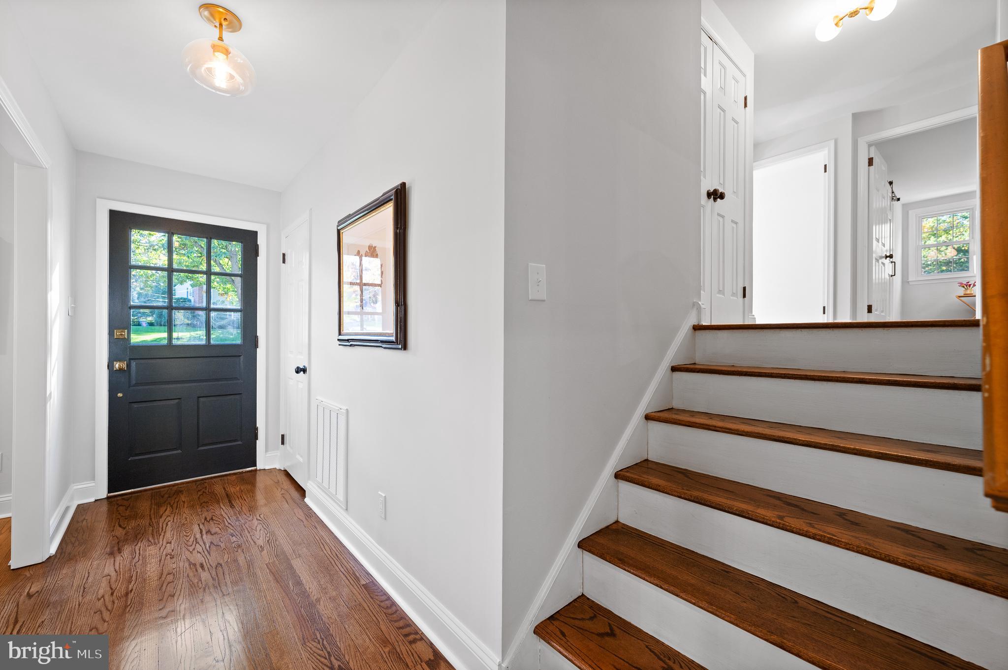 190 Woodstock Road Villanova, PA 19085 - Photo 24 of 52 Front hall with stairwell to upper and lower level