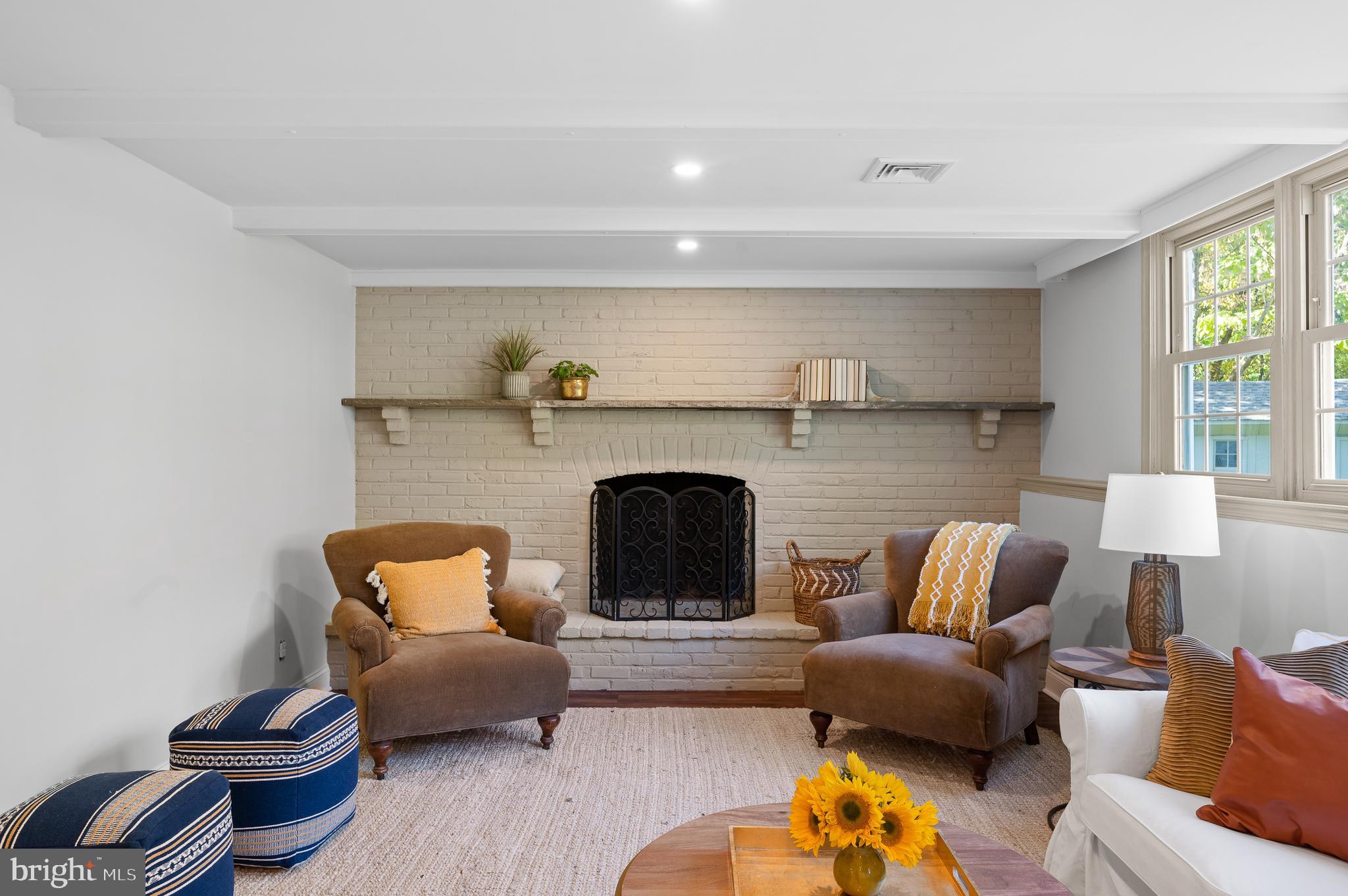 190 Woodstock Road Villanova, PA 19085 - Photo 39 of 52 painted brick fireplace with brick bench
