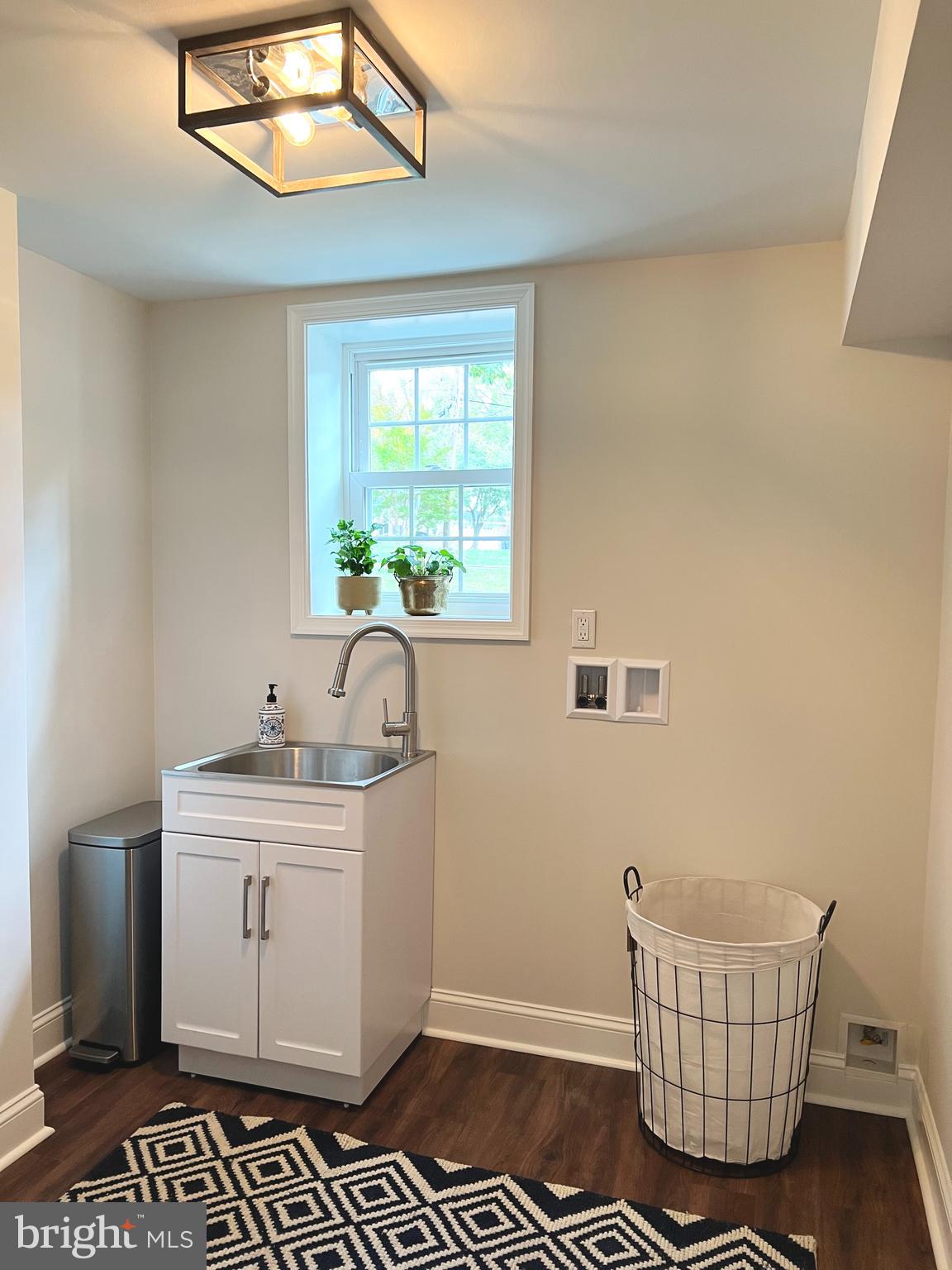 190 Woodstock Road Villanova, PA 19085 - Photo 42 of 52 Lower level sunny laundry room with utility sink