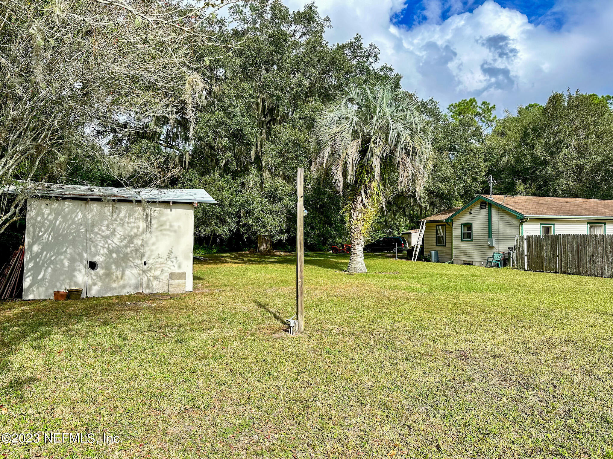 2158 Parental Home Road Jacksonville, FL 32216 - Photo 14 of 18 a view of a house with backyard and trees
