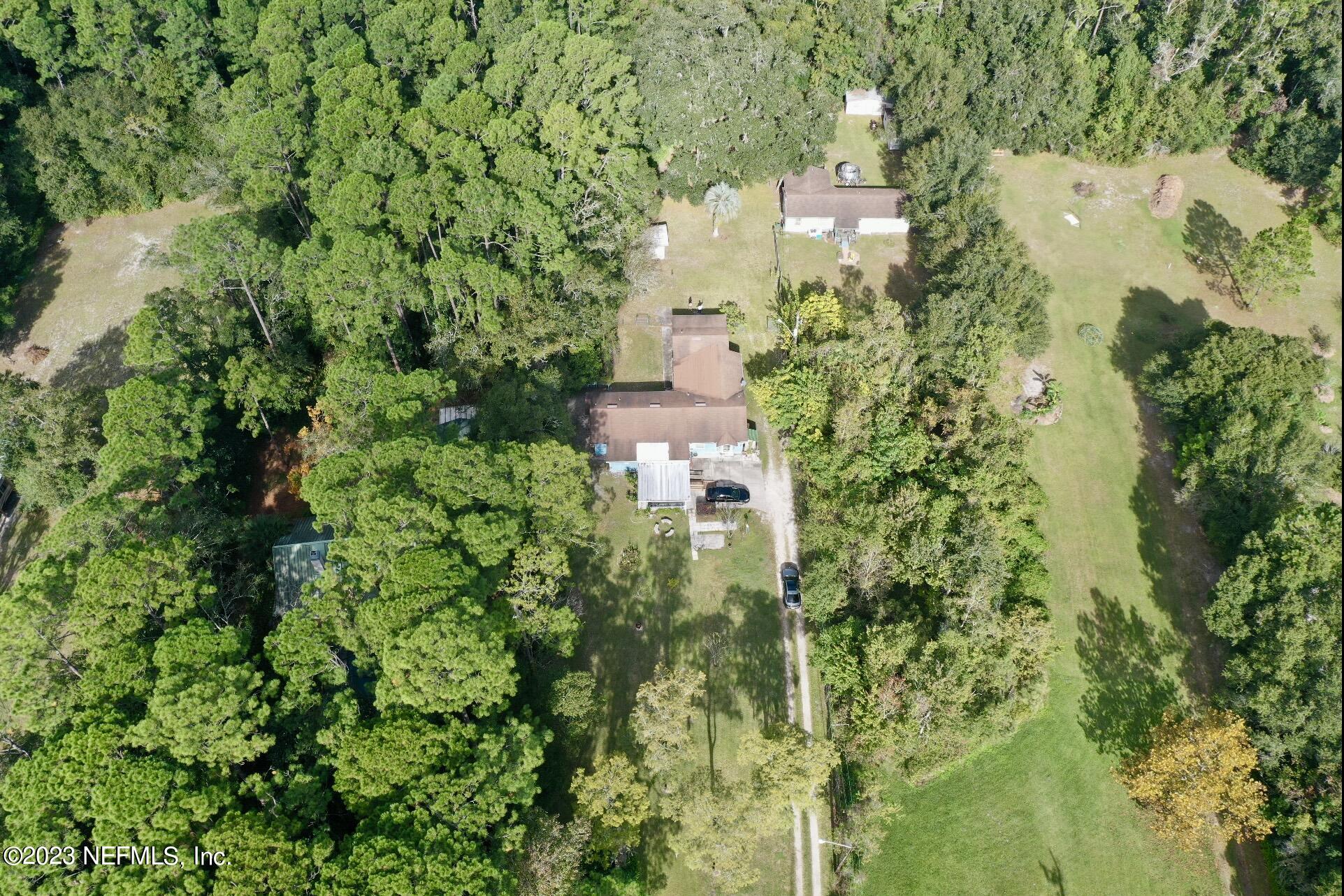 2158 Parental Home Road Jacksonville, FL 32216 - Photo 18 of 18 an aerial view of residential house with outdoor space and trees all around