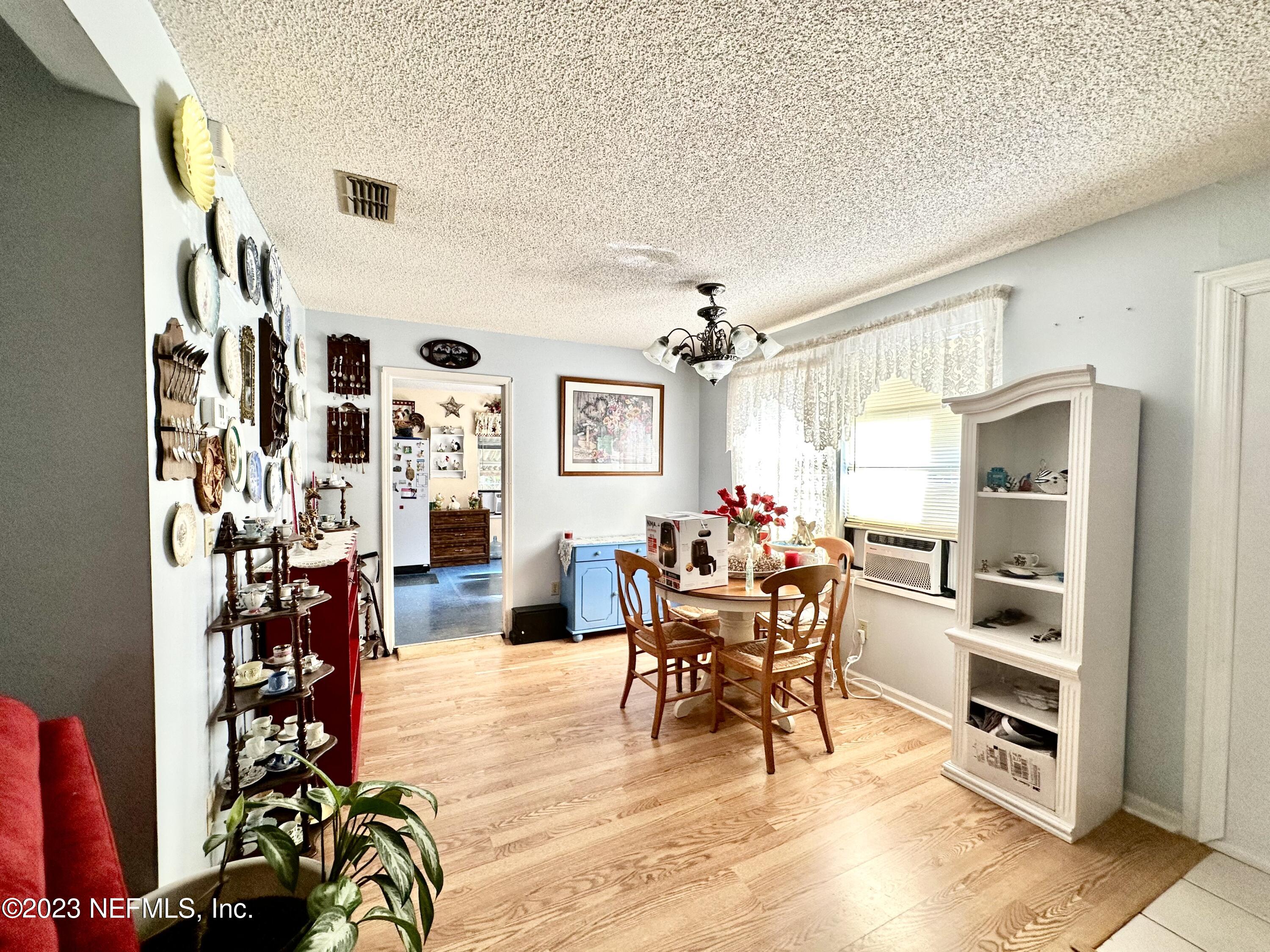2158 Parental Home Road Jacksonville, FL 32216 - Photo 4 of 18 a living room with furniture and wooden floor