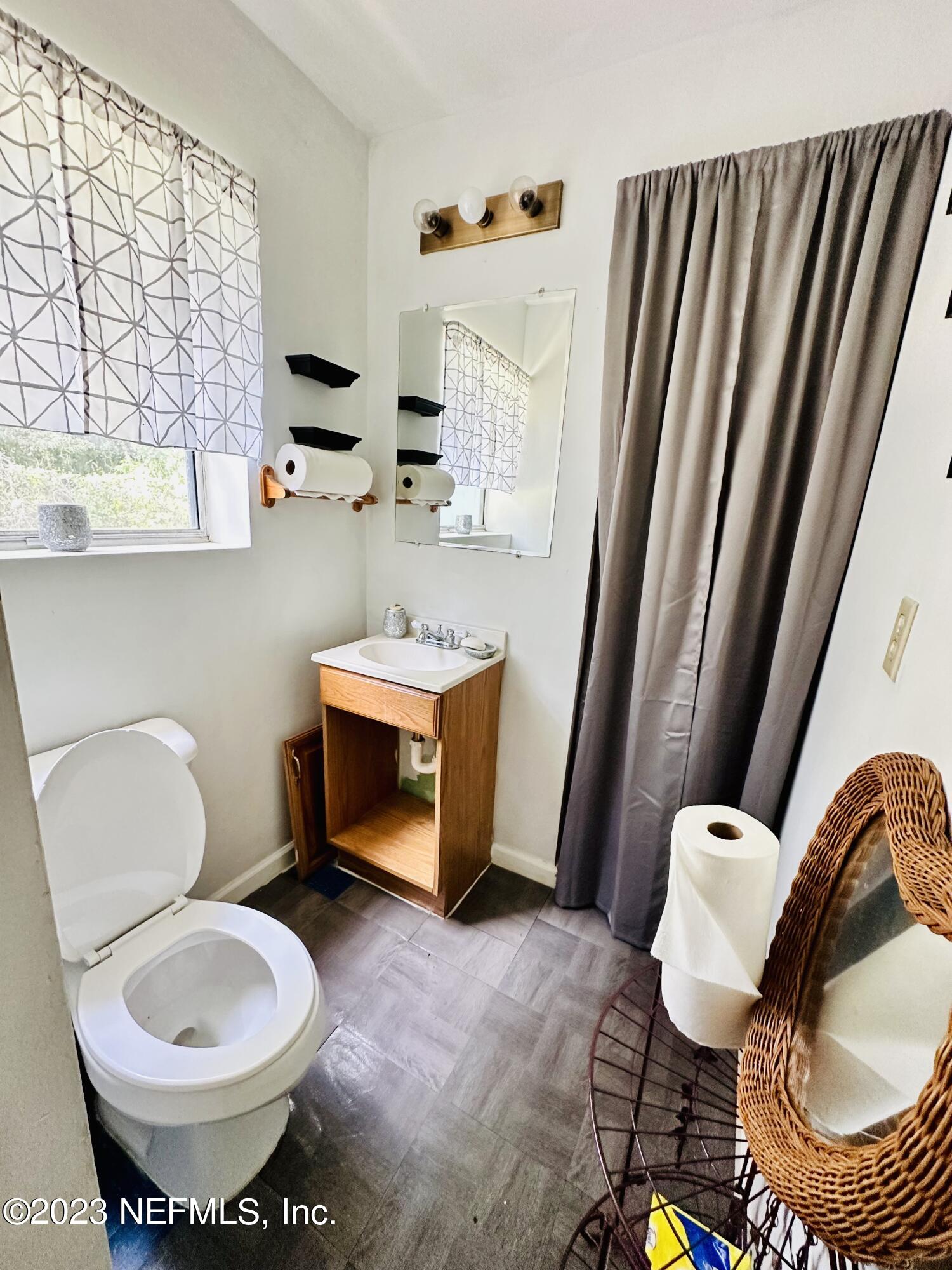 2158 Parental Home Road Jacksonville, FL 32216 - Photo 7 of 18 a bathroom with a toilet and a sink