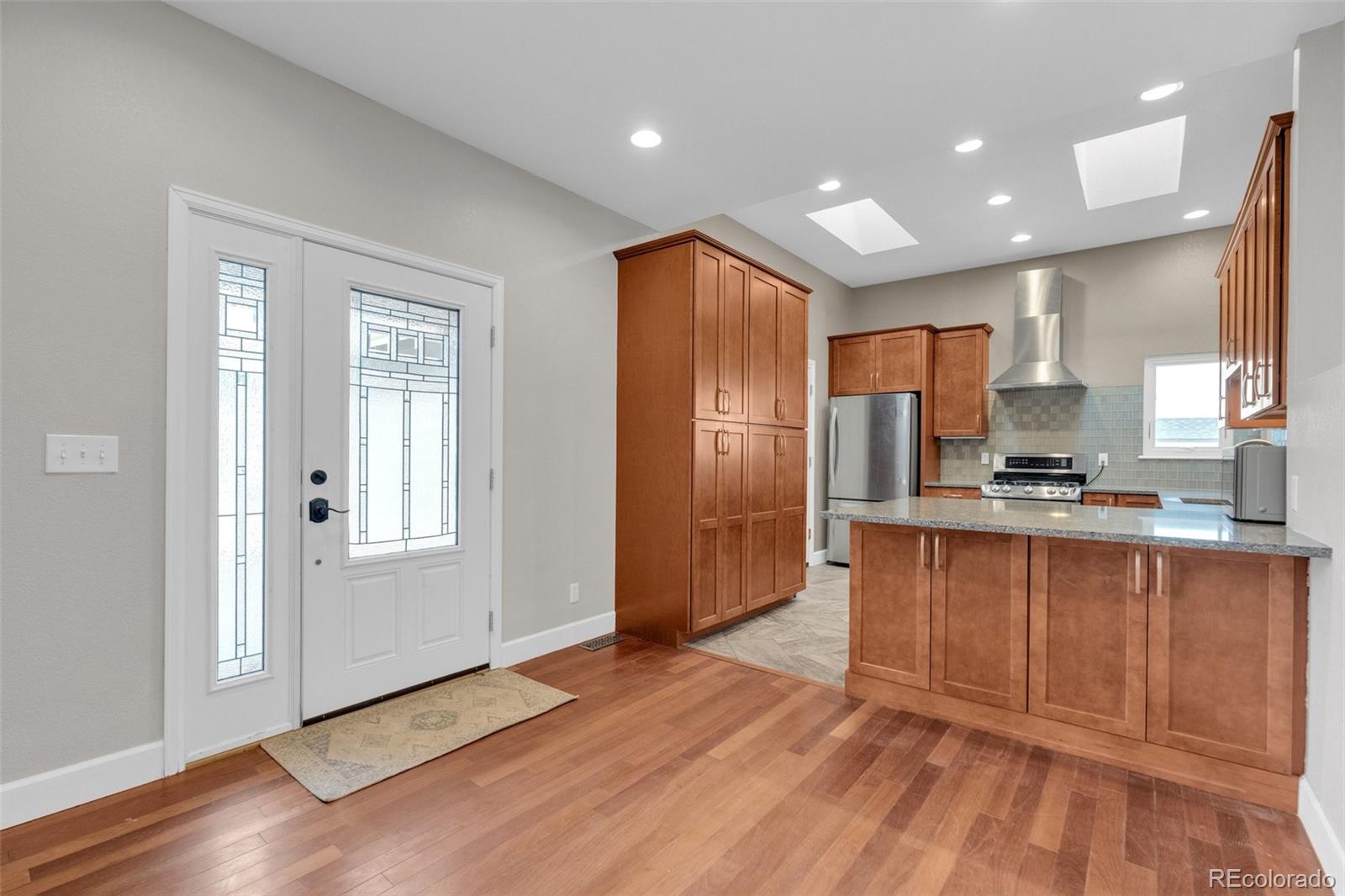 1227 Coronado Road Elizabeth, CO 80107 - Photo 12 of 45 a open kitchen with stainless steel appliances granite countertop a refrigerator and a sink