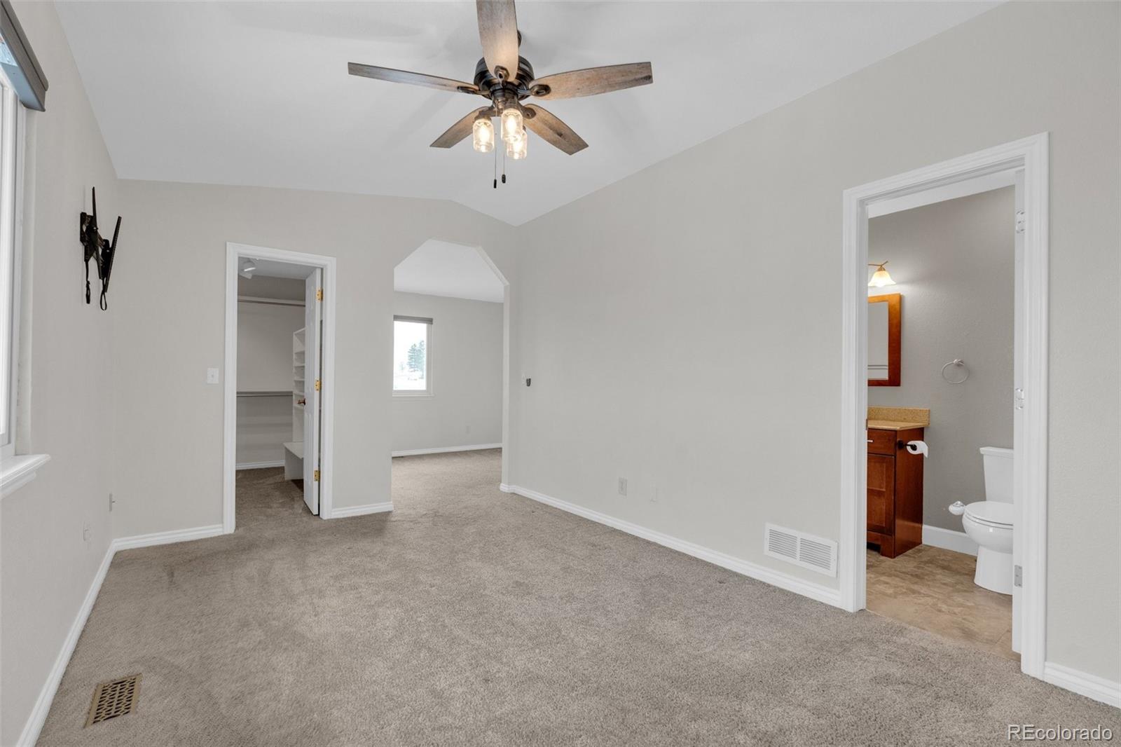1227 Coronado Road Elizabeth, CO 80107 - Photo 16 of 45 wooden floor in an empty room with a bathroom