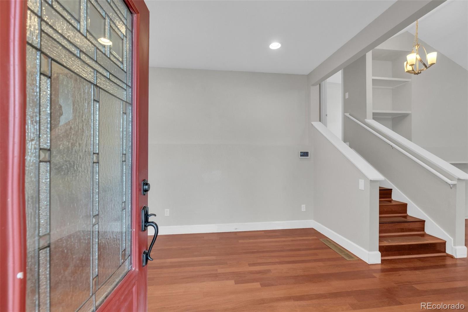 1227 Coronado Road Elizabeth, CO 80107 - Photo 2 of 45 a view of an entryway with wooden floor