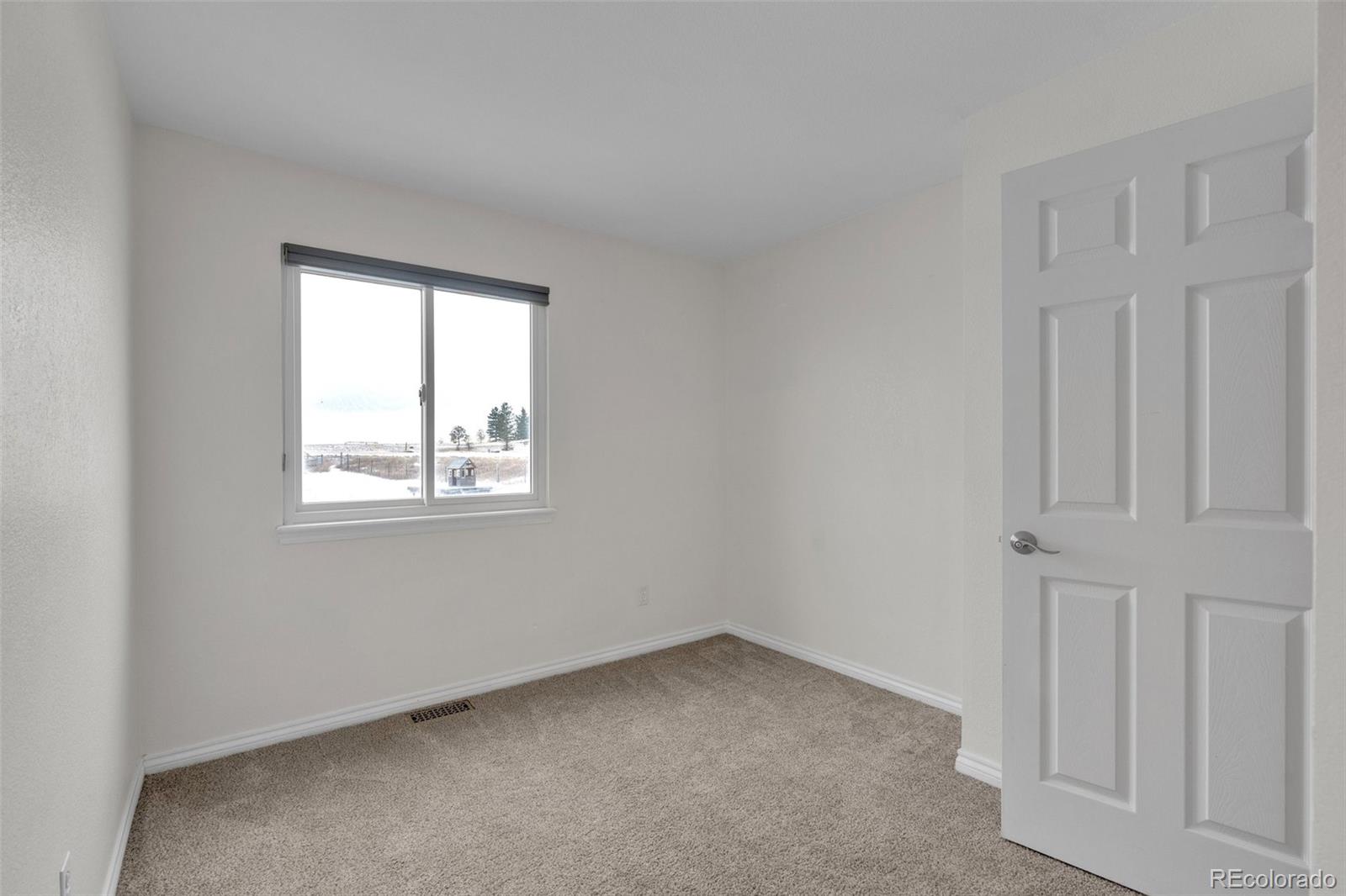 1227 Coronado Road Elizabeth, CO 80107 - Photo 23 of 45 an empty room with a window