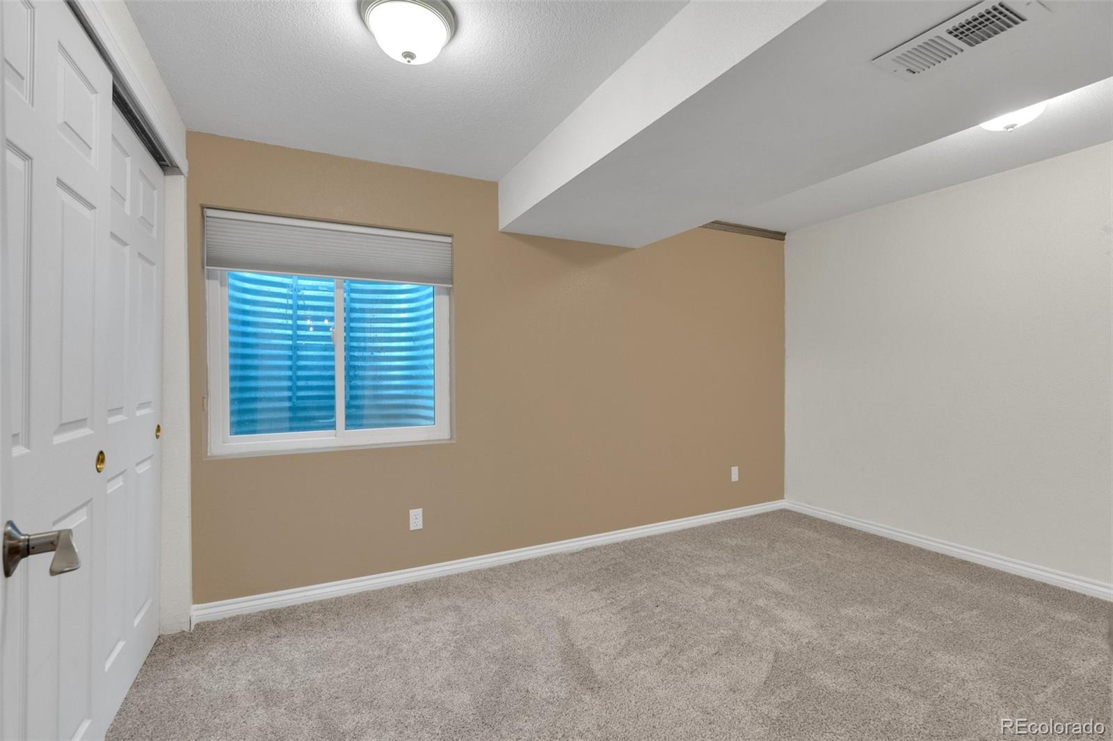 1227 Coronado Road Elizabeth, CO 80107 - Photo 25 of 45 a view of an empty room with a window