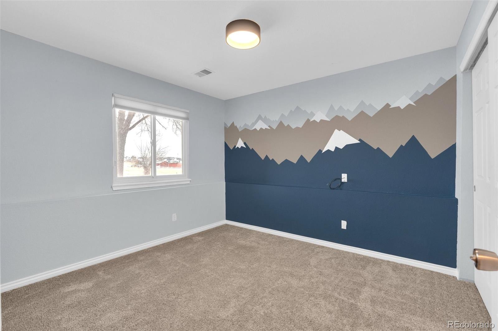 1227 Coronado Road Elizabeth, CO 80107 - Photo 27 of 45 a view of an empty room with a window