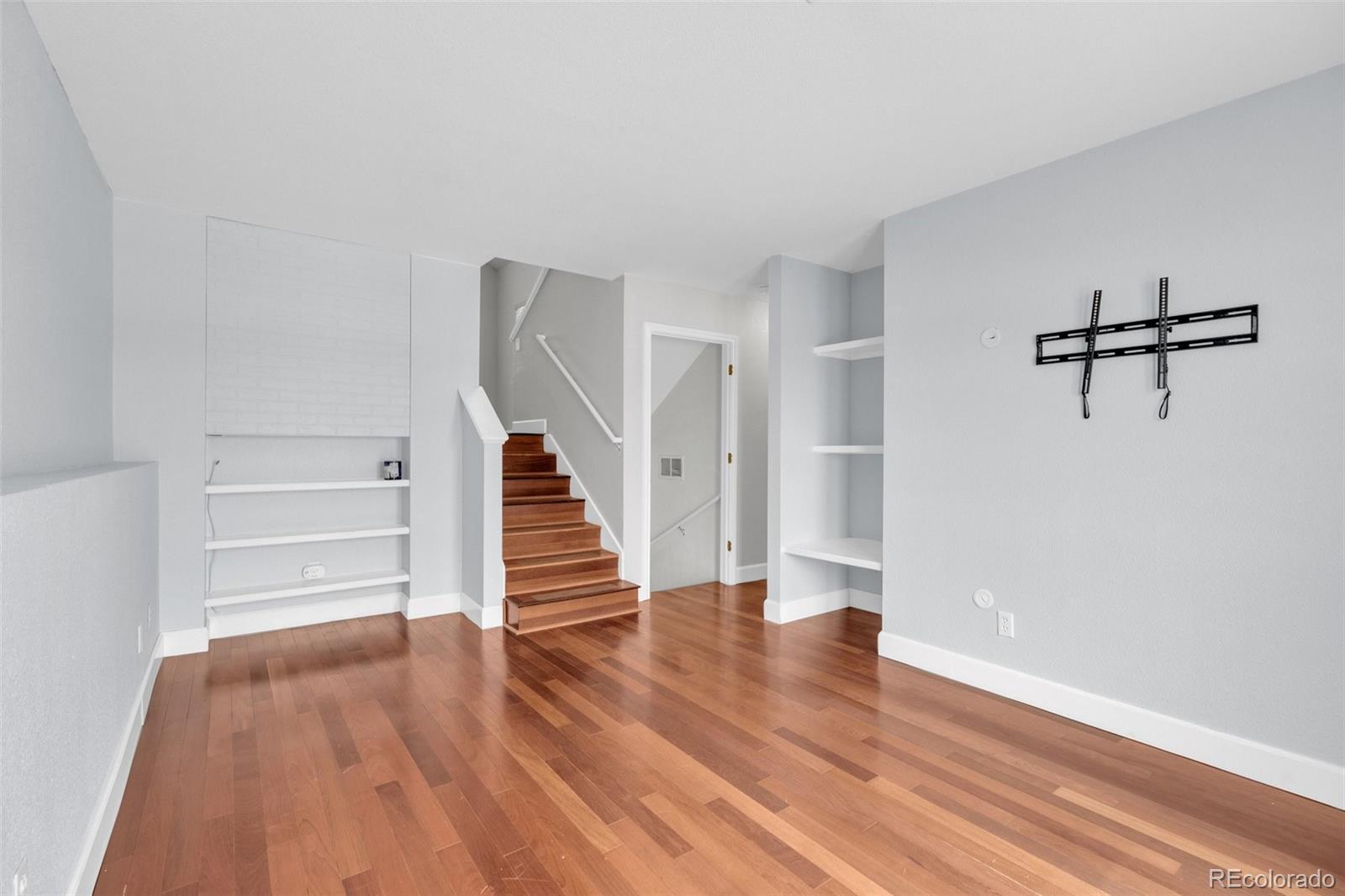 1227 Coronado Road Elizabeth, CO 80107 - Photo 30 of 45 a view of a room with wooden floor and stairs