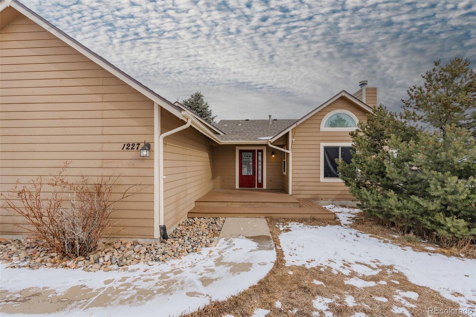 1227 Coronado Road Elizabeth, CO 80107 - Photo 35 of 45 a view of a house with a yard