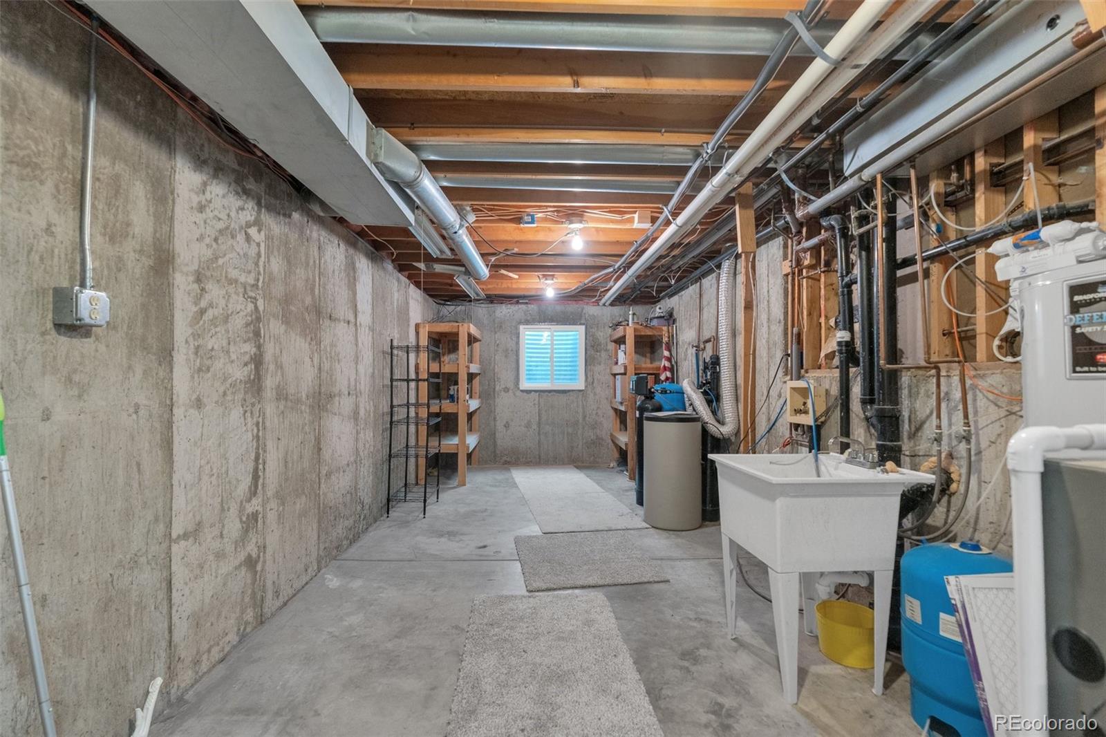 1227 Coronado Road Elizabeth, CO 80107 - Photo 45 of 45 a view of an empty room with wooden floor and furniture