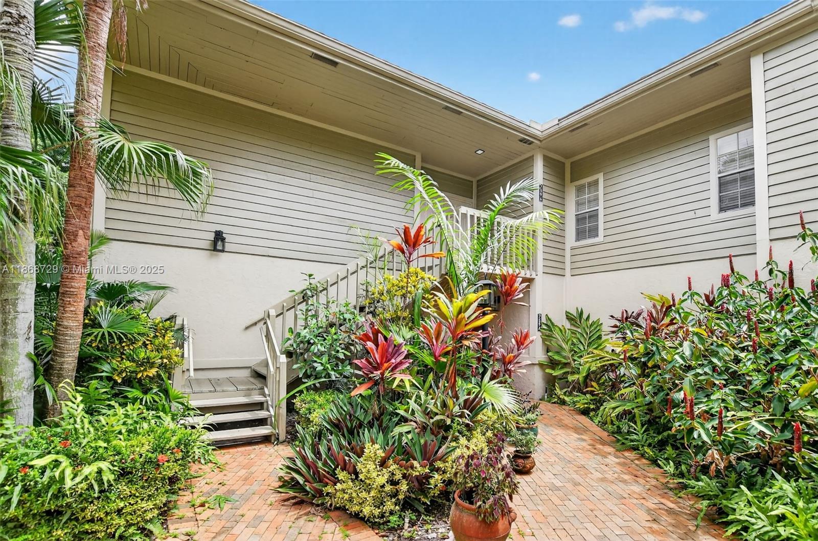 a flower plants in front of a house