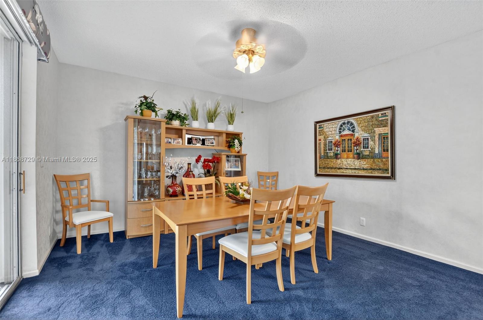 7596 Elm Ridge Drive, Unit 2U Boca Raton, FL 33433 - Photo 15 of 45 a dining room with furniture and wooden floor