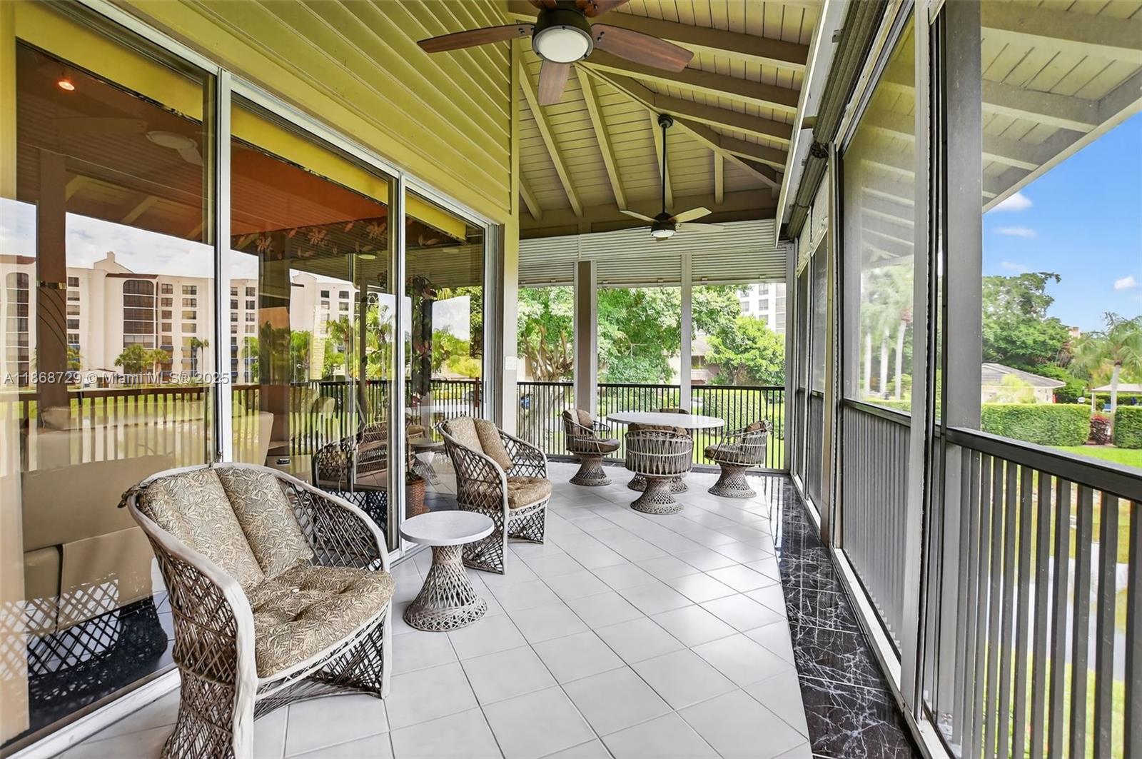 7596 Elm Ridge Drive, Unit 2U Boca Raton, FL 33433 - Photo 27 of 45 a building outdoor space with patio furniture