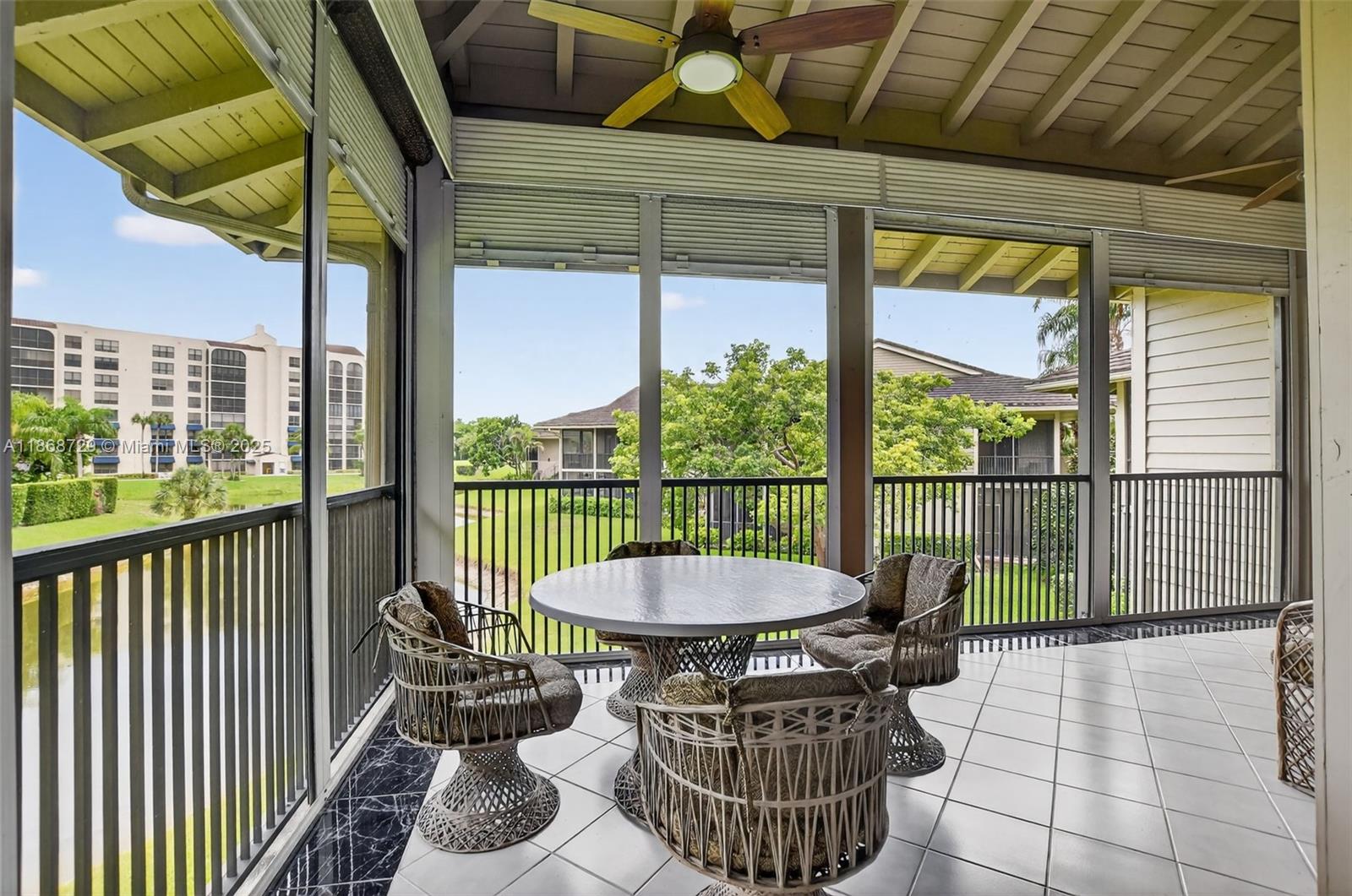 7596 Elm Ridge Drive, Unit 2U Boca Raton, FL 33433 - Photo 30 of 45 a view of a balcony with furniture