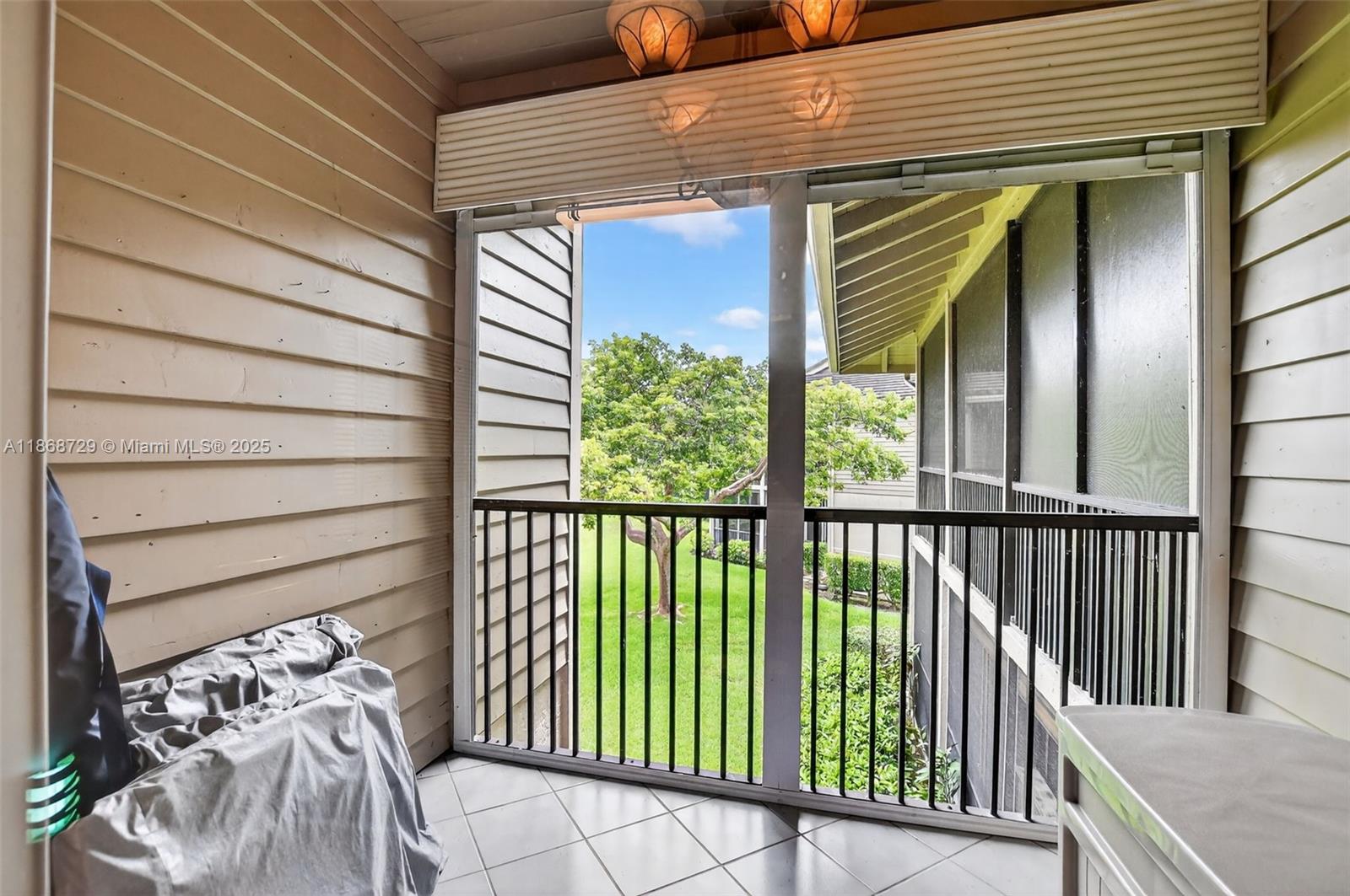 7596 Elm Ridge Drive, Unit 2U Boca Raton, FL 33433 - Photo 32 of 45 a view of a balcony with furniture