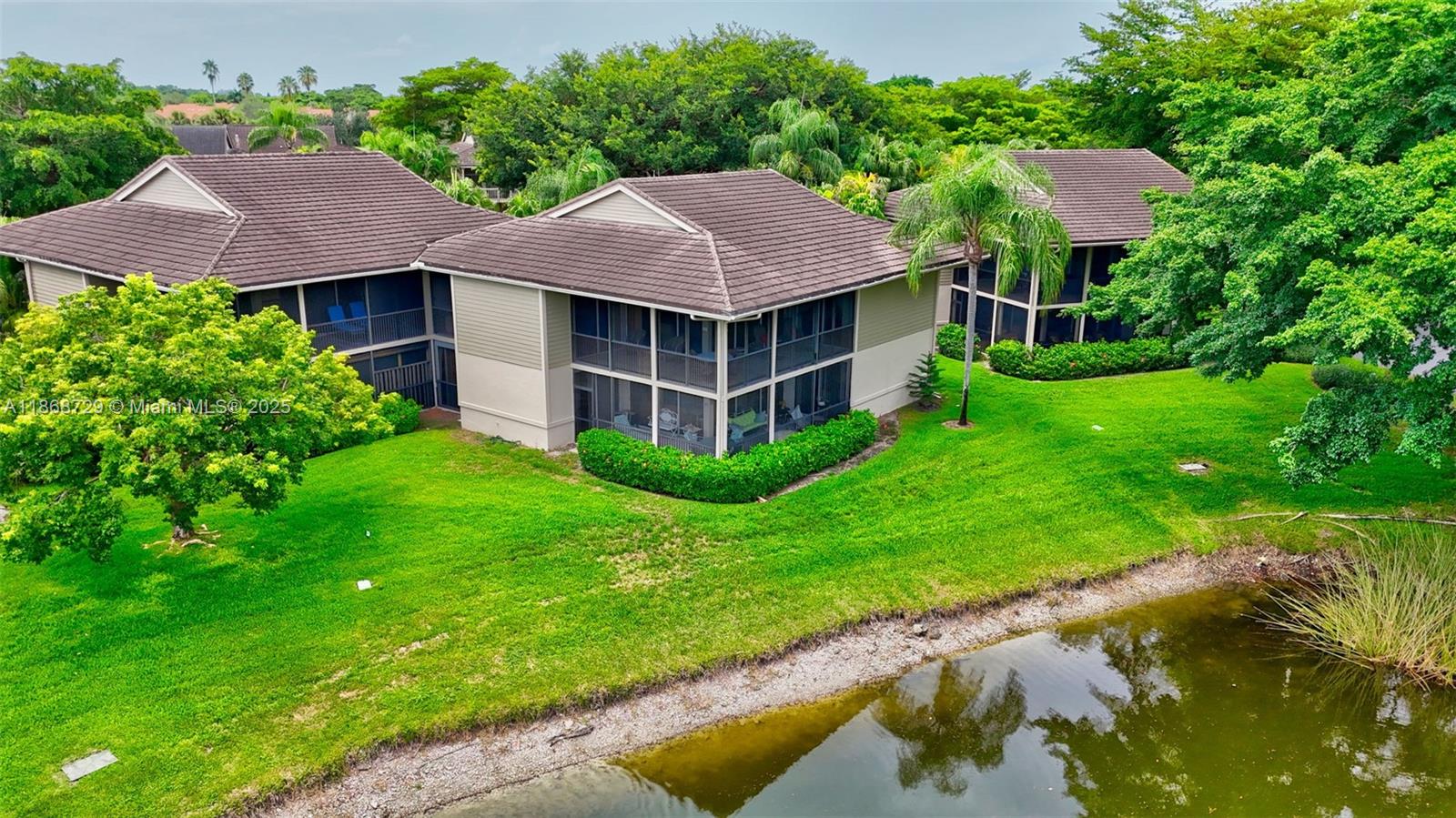 7596 Elm Ridge Drive, Unit 2U Boca Raton, FL 33433 - Photo 35 of 45 a aerial view of a house with a yard and a large pool