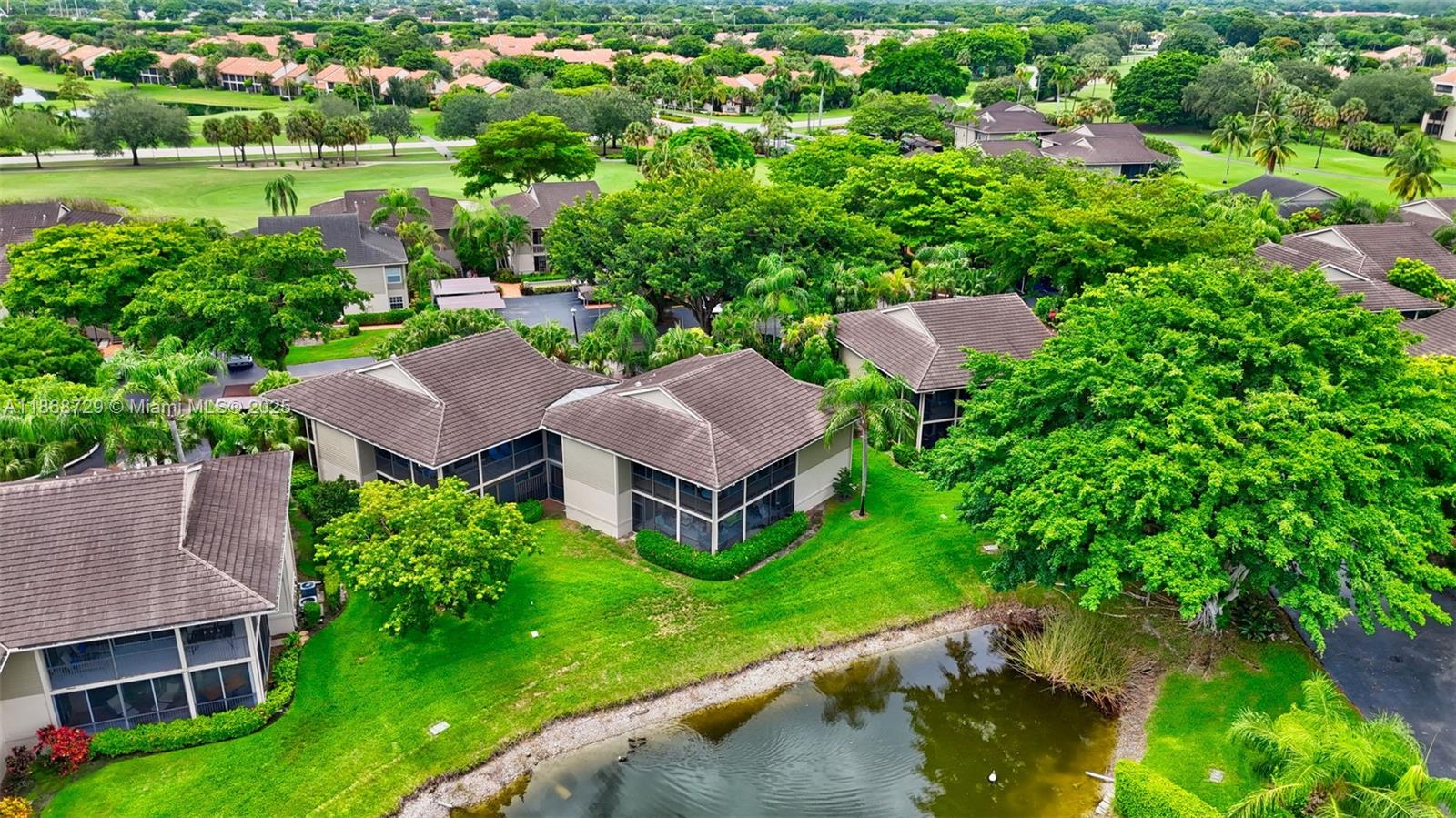 7596 Elm Ridge Drive, Unit 2U Boca Raton, FL 33433 - Photo 45 of 45 an aerial view of a house with yard swimming pool and outdoor seating