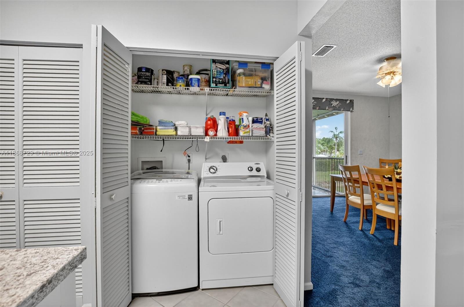 7596 Elm Ridge Drive, Unit 2U Boca Raton, FL 33433 - Photo 8 of 45 a storage room with washer and dryer