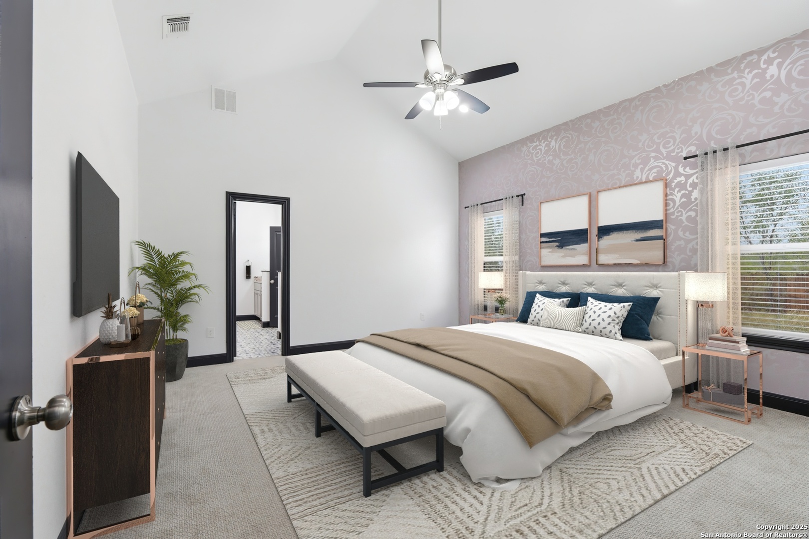 128 Hidden Ranch Court Floresville, TX 78114 - Photo 18 of 39 a bedroom with a large bed and a chandelier