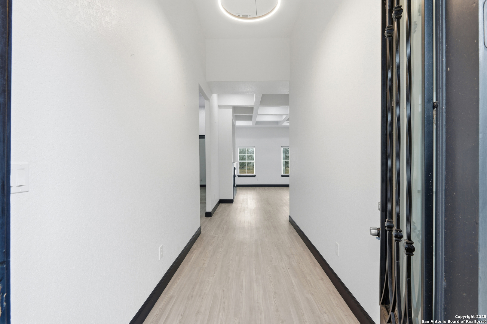 128 Hidden Ranch Court Floresville, TX 78114 - Photo 5 of 39 a view of a hallway with wooden floor