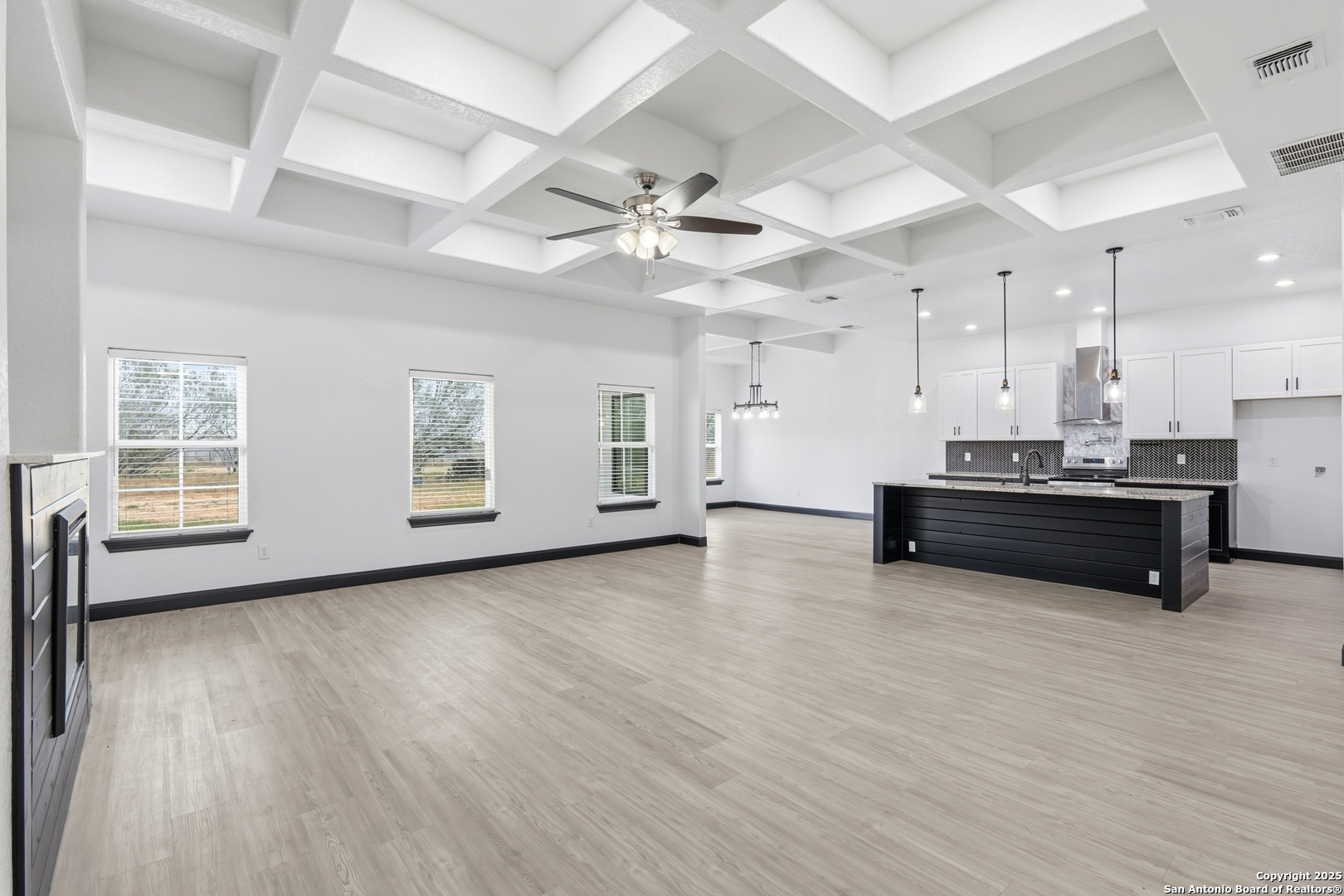 128 Hidden Ranch Court Floresville, TX 78114 - Photo 7 of 39 a view of kitchen and kitchen with wooden floor