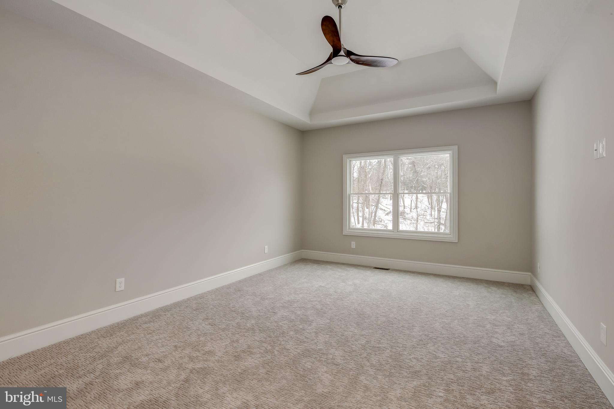 102 Harvey Road, Unit 1PS Wallingford, PA 19086 - Photo 11 of 18 a view of an empty room with a window