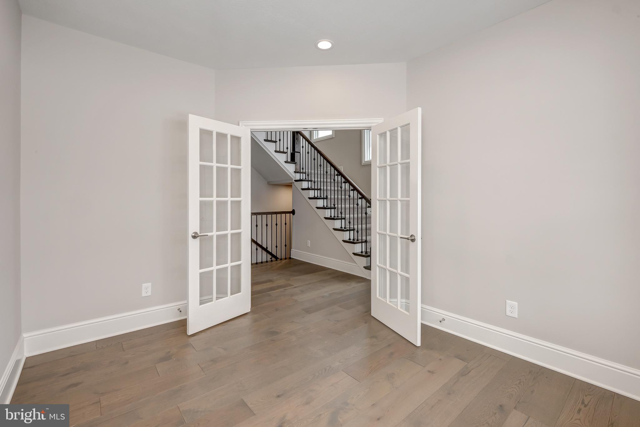 102 Harvey Road, Unit 1PS Wallingford, PA 19086 - Photo 5 of 18 a view of entryway with stairs
