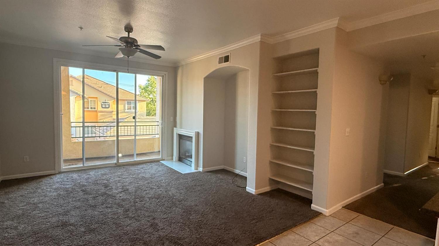 1360 Shady Lane, Unit 923 Turlock, CA 95382 - Photo 2 of 13 a view of an empty room with a window
