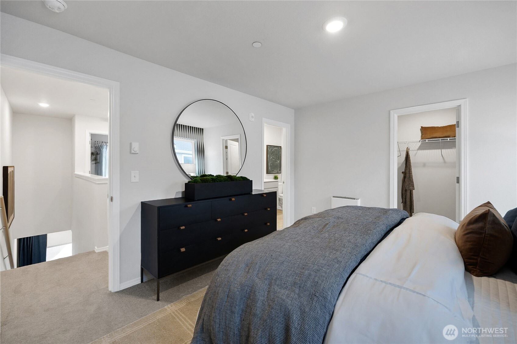 34140 Emerald Ridge Avenue Southeast Black Diamond, WA 98010 - Photo 12 of 24 a bedroom with a bed and a dresser