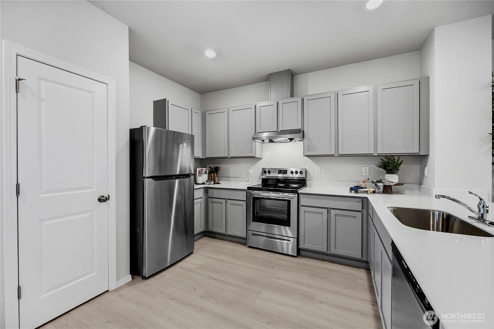 34140 Emerald Ridge Avenue Southeast Black Diamond, WA 98010 - Photo 3 of 24 a kitchen with a refrigerator sink and stainless steel appliances