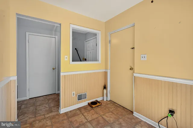 a view of a hallway with closet