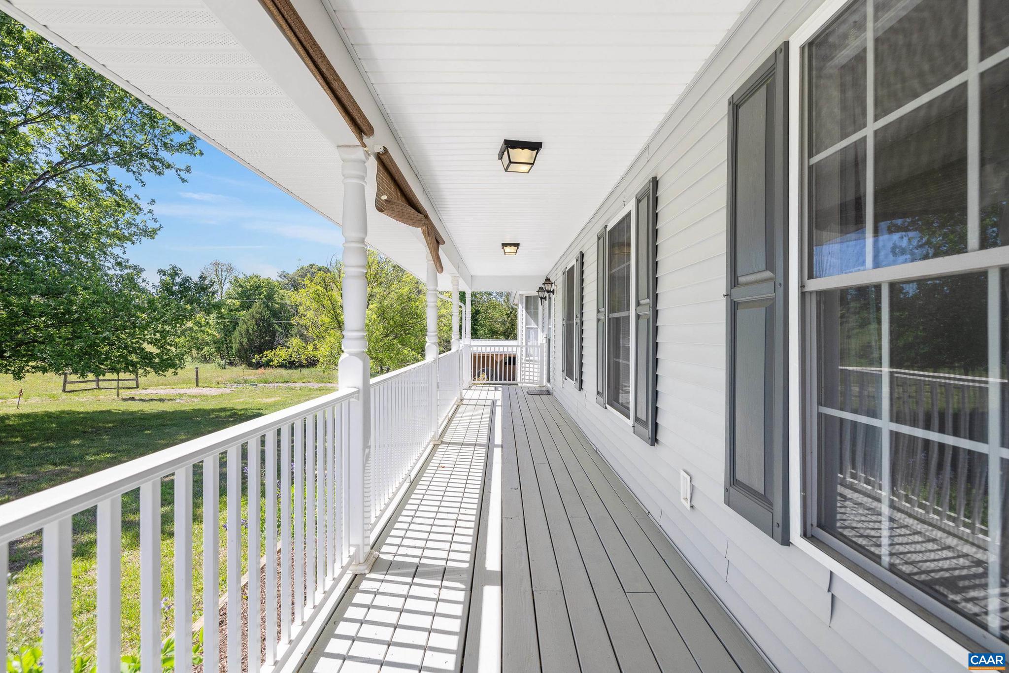 1075 Social Hall Road New Canton, VA 23123 - Photo 32 of 64 a view of balcony with wooden floor and fence