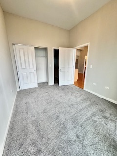 1464 South Michigan Avenue, Unit 2007 Chicago, IL 60605 - Photo 8 of 22 an empty room with windows