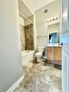 a bathroom with a toilet a sink and bathtub