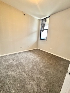 1464 South Michigan Avenue, Unit 2007 Chicago, IL 60605 - Photo 10 of 22 an empty room with windows