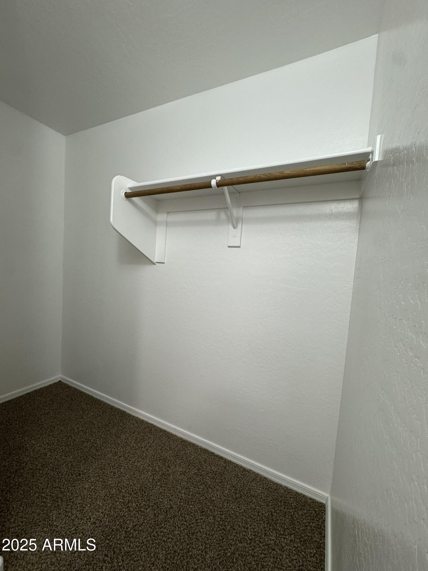 2311 West Hunter Court Phoenix, AZ 85085 - Photo 11 of 24 a view of small space with racks on the wall